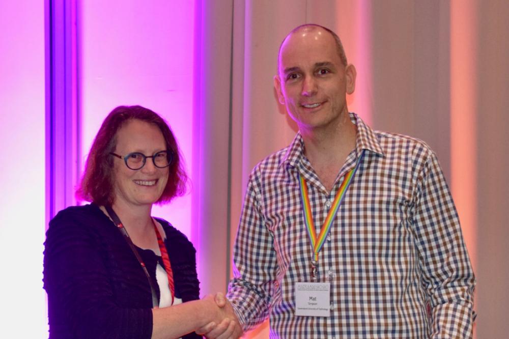 Professor Matthew Simpsons receiving the EO Tuck Medal from  Yvonne Stokes